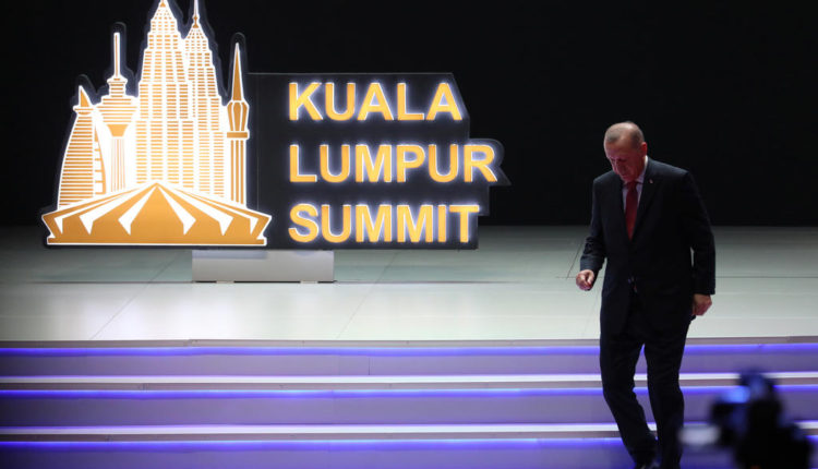 Turkey’s President Recep Tayyip Erdogan leaves the stage after his speech during Kuala Lumpur Summit in Kuala Lumpur